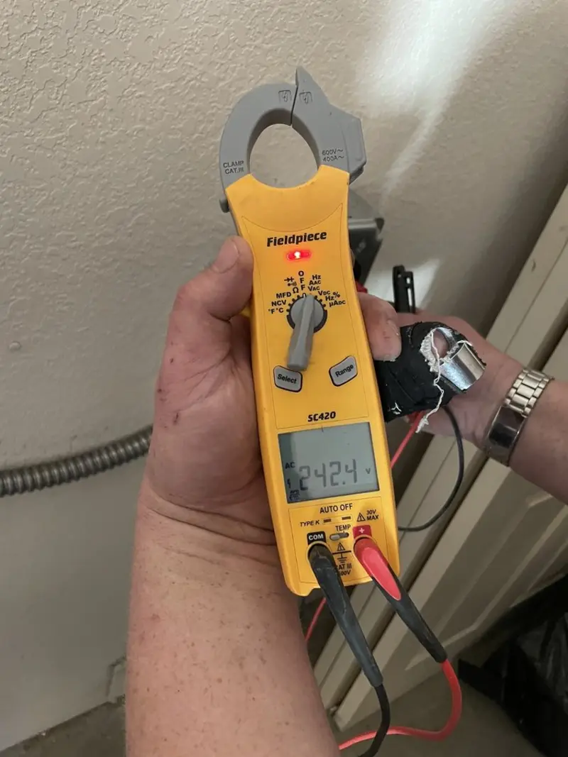 Voltage testing with clamp meter during Whole House Surge Protector in Summerfield